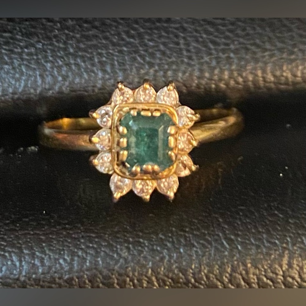A rich royalty-inspired design.14k emerald green set with diamonds.